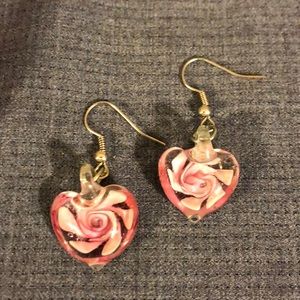 Heart shaped earrings with crystal and rose inside